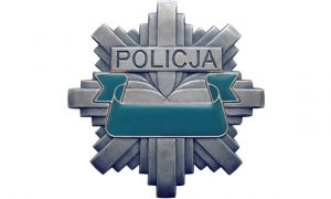 policyjna rozeta z napisem policja