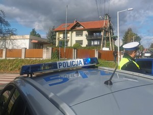 na pierwszym planie radiowóz w tle ulica