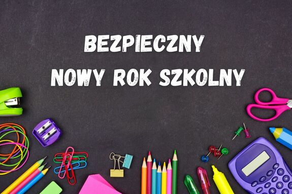 Napis bezpieczny nowy rok szkolny. Na obrazku widoczne również przybory szkolne
